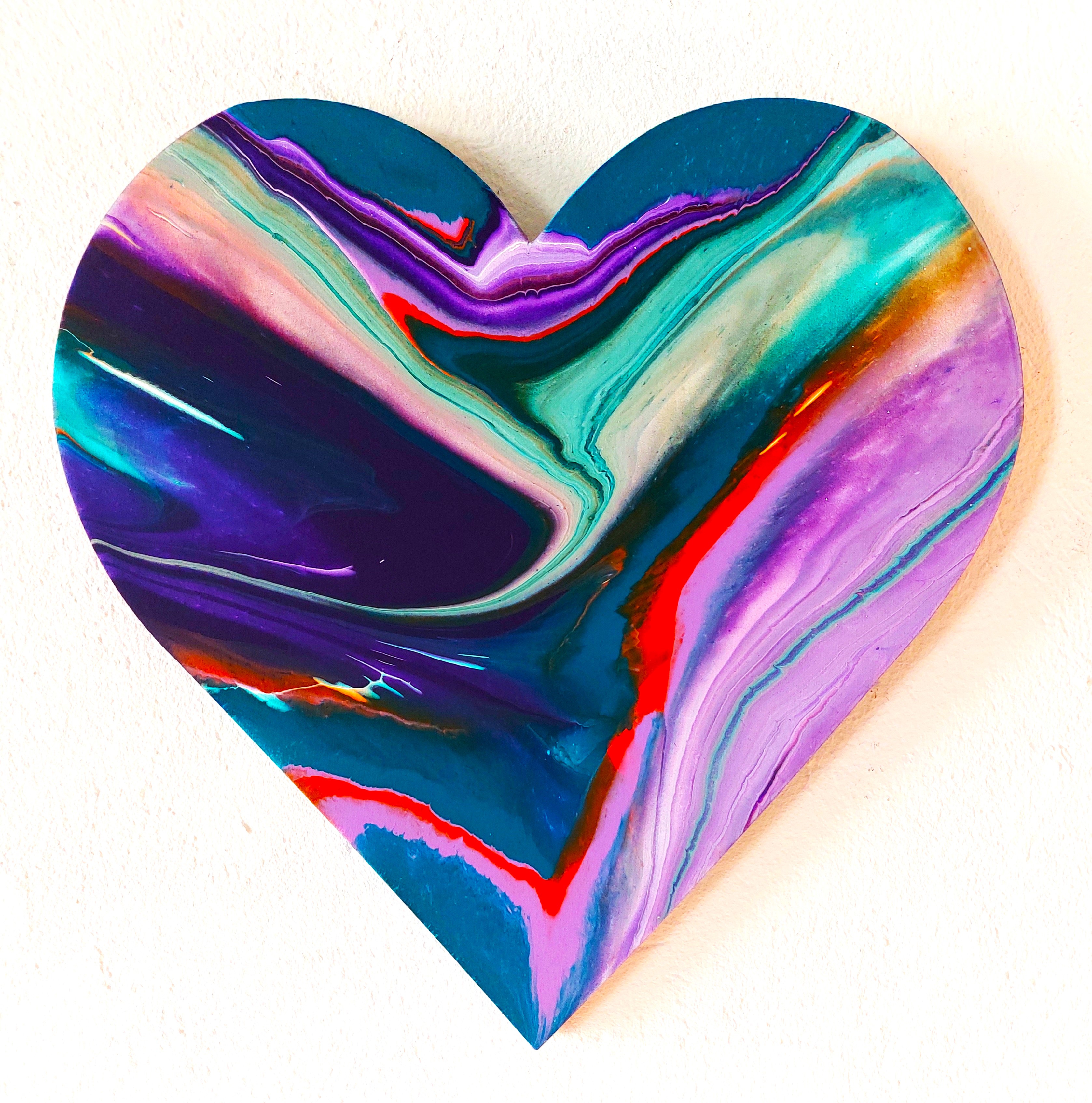 Heart-shaped spin painting in turquoise, violet and pink