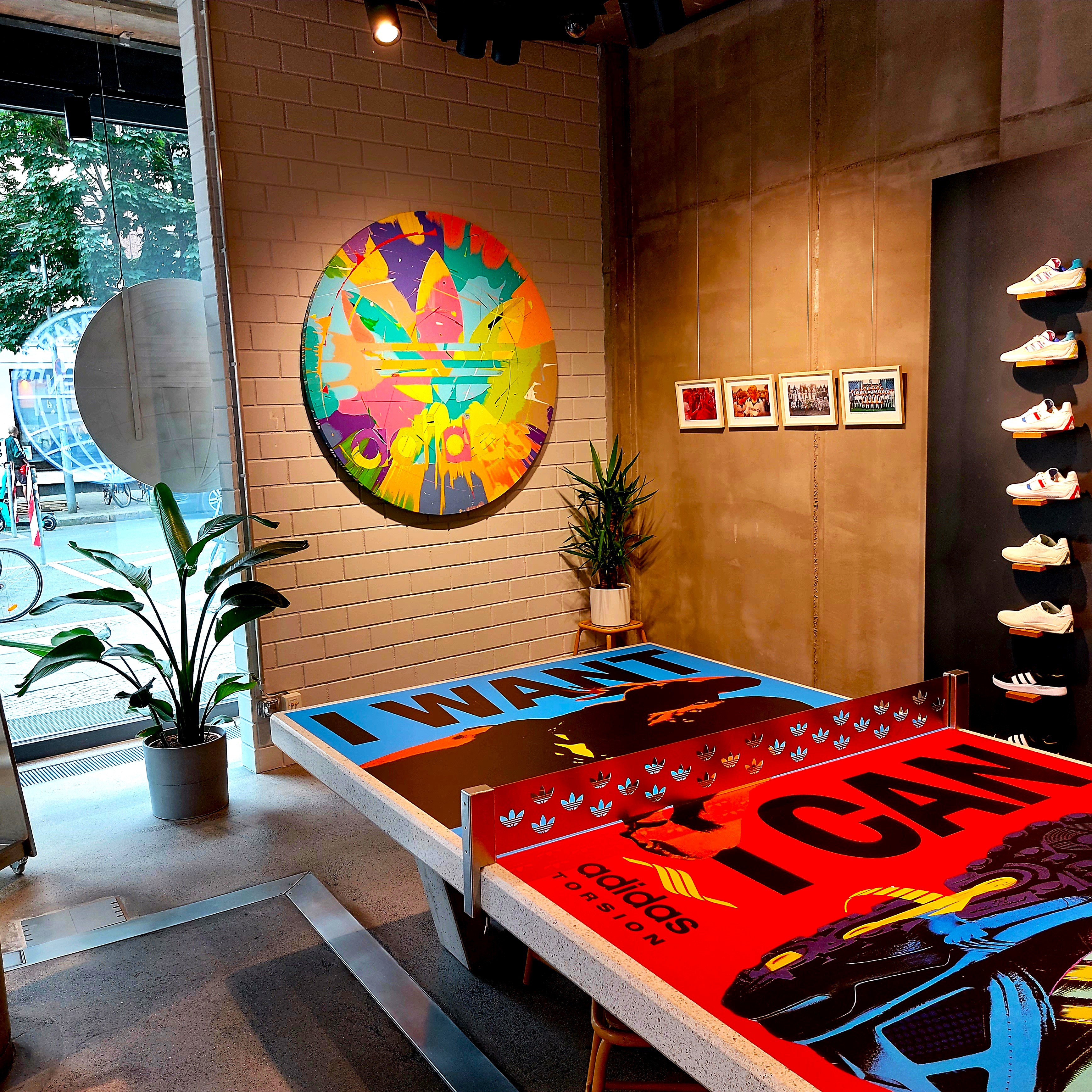 Adidas artwork and custom-designed tables in the store
