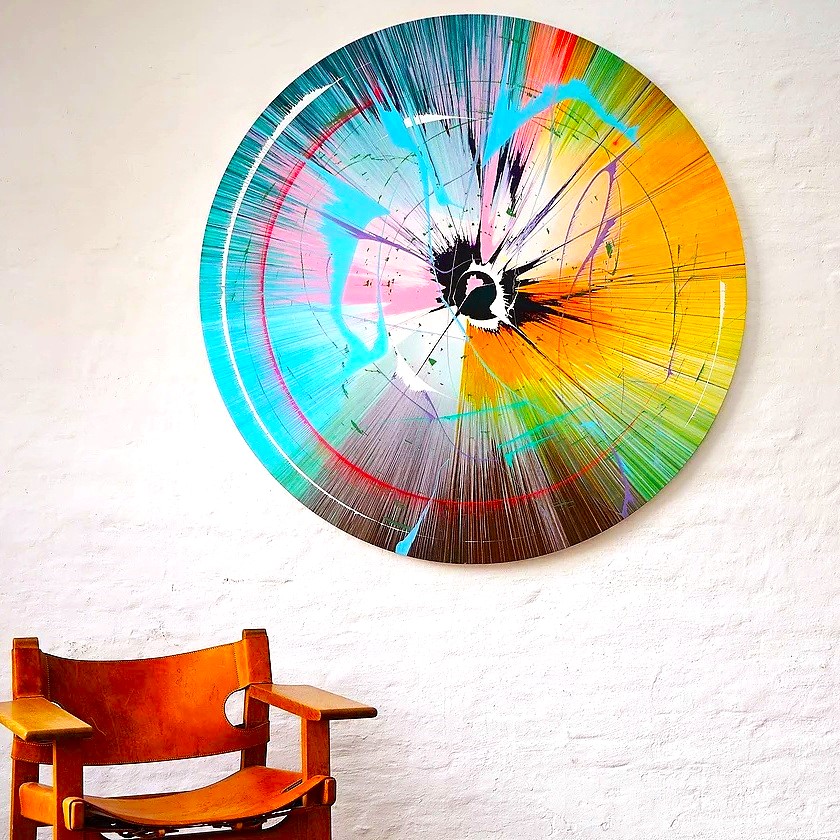 Round original above a leather chair