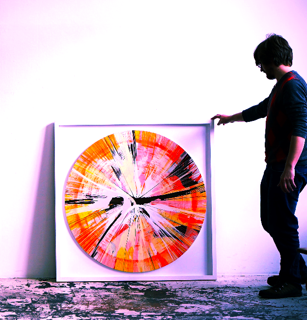 Framed round original with a person in the studio