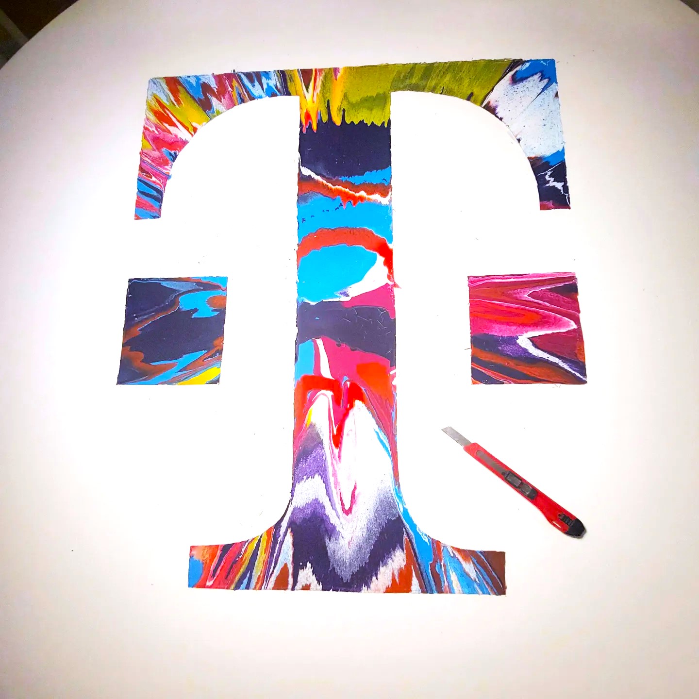 Telekom emblem assembled from painted sections
