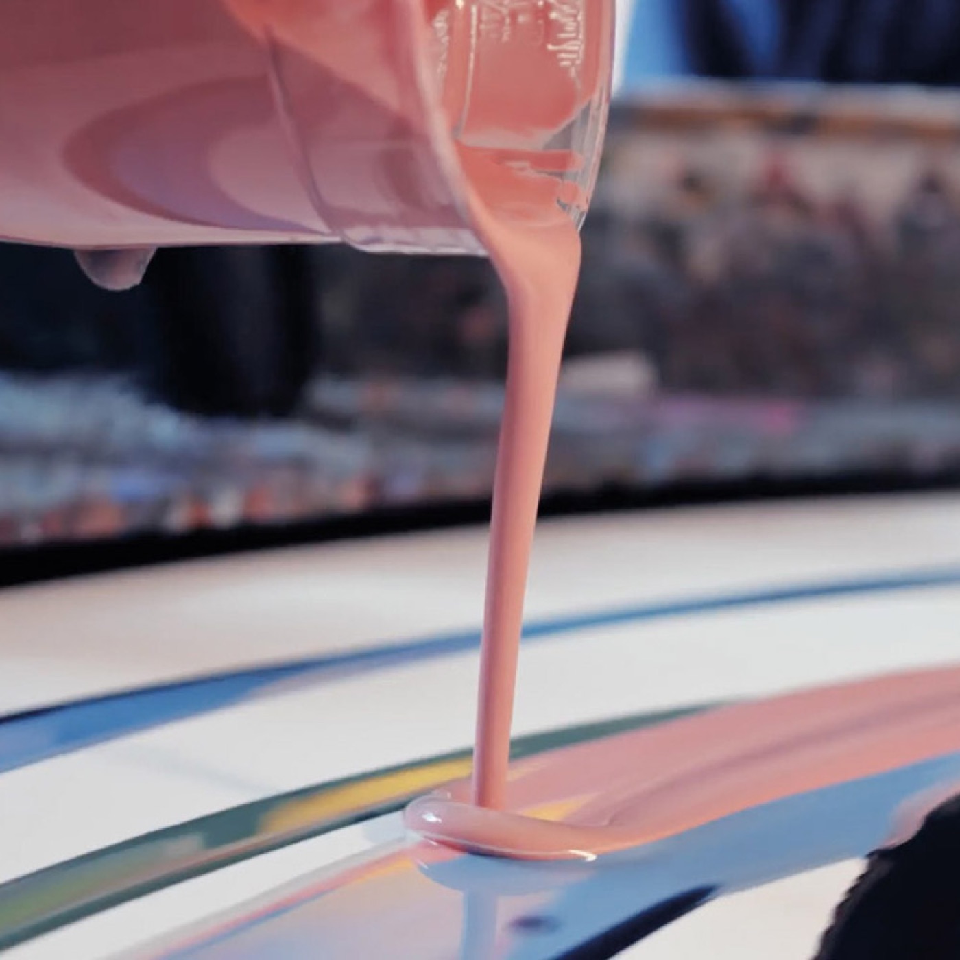 Pink paint being poured onto the canvas for the KaVo campaign